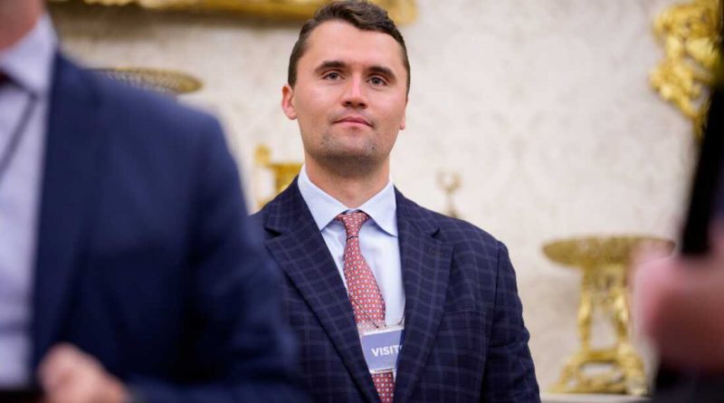 Charlie Kirk in suit in white house