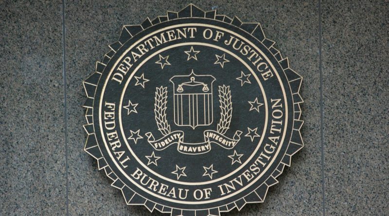 the seal of the department of justice on a wall